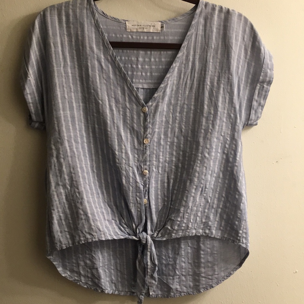 Button up high in the front long in the back